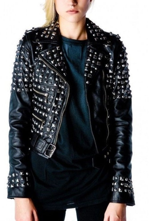 Woman studded black leather biker jacket heavily embellished with silver pyramid studs.