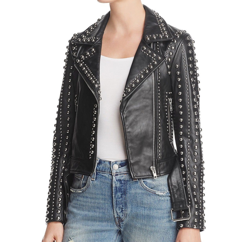 Women's studded black leather biker jacket with heavy silver dome studs, Brando style, featuring asymmetrical zipper and waist belt. Women's studded black leather biker jacket with heavy silver dome studs, Brando style, featuring asymmetrical zipper and waist belt.