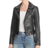 Women's studded black leather biker jacket with heavy silver dome studs, Brando style, featuring asymmetrical zipper and waist belt. Women's studded black leather biker jacket with heavy silver dome studs, Brando style, featuring asymmetrical zipper and waist belt.