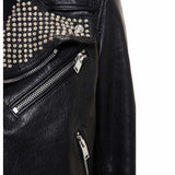 Men's black leather Brando biker jacket with heavily studded lapels, asymmetrical zipper, belt, and silver hardware.