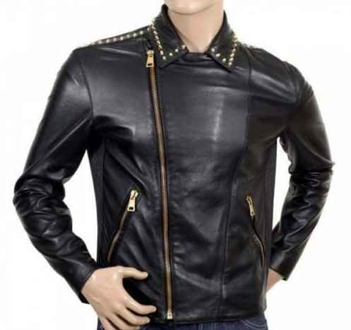 Men's black studded leather biker jacket with gold studs on lapels, asymmetrical gold zip, and belted waist.