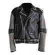 Men's black leather biker jacket with heavy silver pyramid studs and conical spikes, asymmetrical zipper, and waist belt.