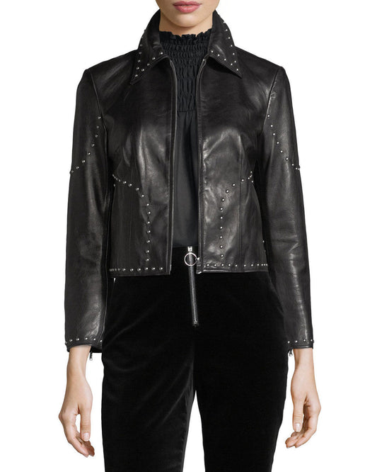 Women's black cropped studded lambskin leather jacket with silver studs outlining the seams and collar.