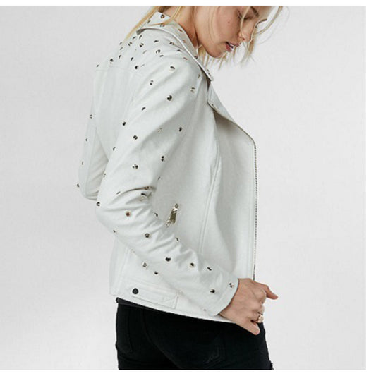 Woman wearing a white studded leather biker jacket with golden studs and an asymmetrical zipper.