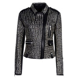 Women's studded black leather motorcycle jacket completely covered in polished silver studs.