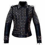 Women's studded black leather biker jacket with heavy silver pyramid studs on the body and upper arms.