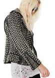 Women's black leather biker jacket fully covered in silver dome studs, rock star style with asymmetrical zipper.