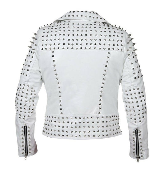 Women's studded white leather biker jacket with silver conical spikes on shoulders, heavy dome studs, asymmetrical zipper, and waist belt.